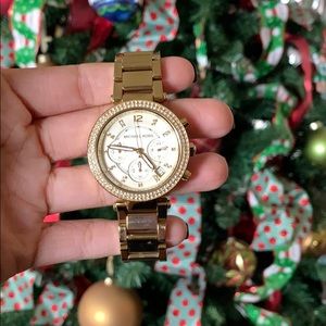 Gold Michael Kors watch with pave diamond face